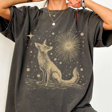 Vintage Folklore Fox Shirt, Celestial, MoonT-shirt, Cottagecore, Boho, Forestcore, Folk Art, Dark Academia Tee, Comfort Colors® Gildan is back with its garment-dyed t-shirt, a fully customizable tee made 100% with ring-spun cotton. The soft-washed, garment-dyed fabric brings extra coziness to your wardrobe while the relaxed fit makes it an excellent daily choice. The double-needle stitching throughout the tee makes it highly durable while the lack of side-seams helps the shirt retain its tubular Boho T-shirt, Magic Clothes, Fox Shirt, Art Dark, Dyed Fabric, Fall Looks, Dark Academia, Dye T Shirt, Comfort Colors