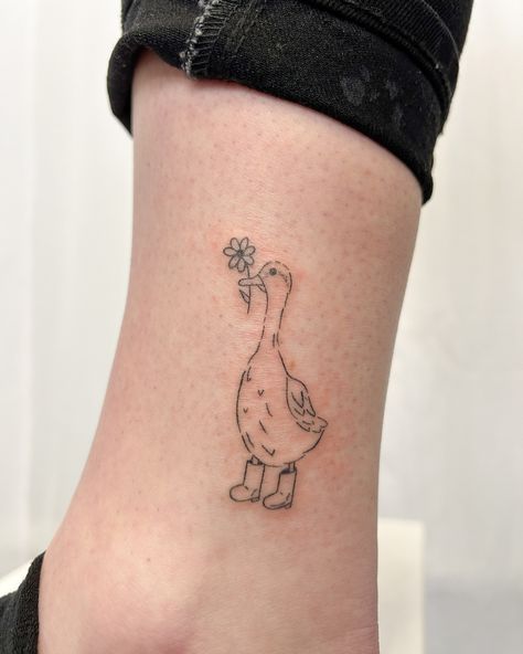 Some cute & quirky friends for your feed! . . #handpoke #stickandpoke #machinefree #tattoo #stickandpoketattoo #handpoked #smalltattoos #tinytattoos #handpokegoldcoast #minimaltatt #goldcoasthandpoke #tattooideas #tattooinspo #tattooartist #goldcoasttattoo Duck Stamp Tattoo, Duck With Flower Hat Tattoo, Duck With Hat Tattoo, Cute Quirky Tattoos, Tiny Goose Tattoo, Pickle Tattoo Ideas, Goose Tattoo Traditional, Cute Goose Tattoo, Goose Tattoo Simple