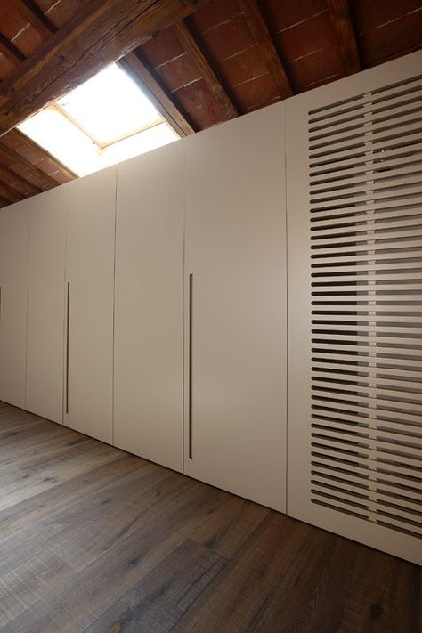 detail of the cupboards showing the custom ventilation grille that hides the dehumidifier Ventilation Holes In Cupboard Doors, Ventilated Closet Doors, Kitchen Cabinet Ventilation Grill, Wardrobe Ventilation Ideas, Cabinet Ventilation Hole Design, Wardrobe With Ventilation, Ventilated Cabinet Doors, Hvac Closet Door Ideas, Kitchen Cabinet Ventilation