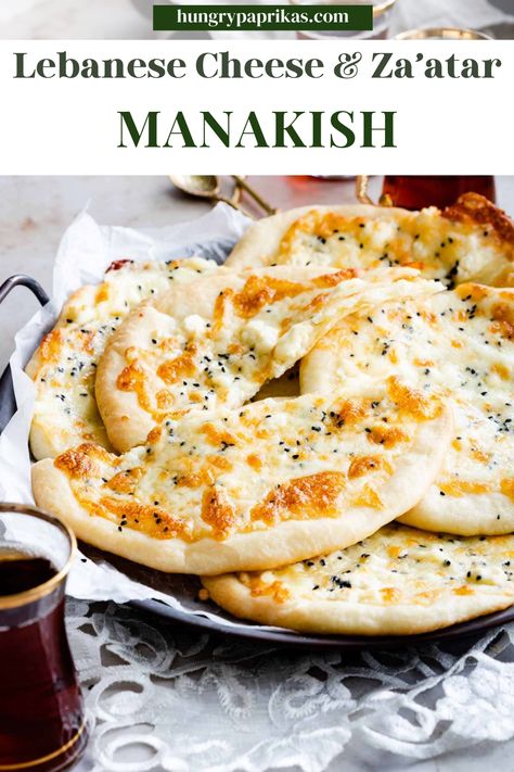 platter with parchment and piled with manakish and a cup of tea Caption Reads: Lebanese Cheese & Za'atar Manakish Kafka Recipe, Manaeesh Dough Recipe, Cheese Manakish Recipe, Lebanese Breakfast Ideas, Manousheh Recipe, Arabic Bread Recipe, Orthodox Fasting Recipes, Vegan Lebanese Recipes, Arabic Breakfast Ideas