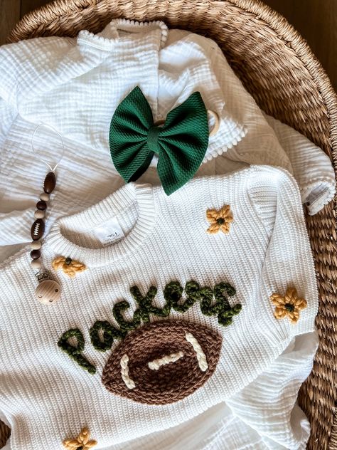 SWEATER IS OVERSIZED. Size down for a true oversized fit Personalized Hand-Embroidered Baby and Toddler Sweaters for all NFL teams Arizona Cardinals Atlanta Falcons Baltimore Ravens Buffalo Bills Carolina Panthers Chicago Bears Cincinnati Bengals Cleveland Browns Dallas Cowboys Denver Broncos Detroit Lions Green Bay Packers Houston Texans Indianapolis Colts Jacksonville Jaguars Kansas City Chiefs Las Vegas Raiders Los Angeles Chargers Los Angeles Rams Miami Dolphins Minnesota Vikings New England Machine Embroidered Sweatshirt, Things To Make With Vinyl, Embroidered Baby Announcement, Little Boy Embroidery Ideas, Baby Clothes Embroidery, Baby Embroidery Ideas, Embroidered Baby Gifts, Gifts For Nephew, Baby Name Sweater