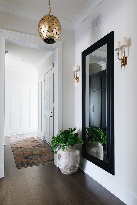 Foyer The full length mirror and gold fixtures really make this foyer area sophisticated and chic Foyer Entry Mirror Foyer Entry Mirror #Foyer #Entry #Mirror Townhouse Interior, Entrance Way, Entryway Mirror, Townhouse Designs, Hal Decor, Foyer Decor, Foyer Decorating, Classic Interior Design, Mirror Designs