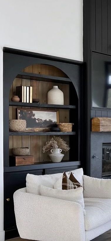 Fireplace Built Ins Black, Black Bookcases Around Fireplace, Bookcase Next To Fireplace Freestanding, Two Tone Built Ins Bookshelves, Modern Tudor House Interior, Paint Built In Bookcase, Wall Of Shelves Living Room, Fireplace With Arched Built Ins, Bookshelves Beside Fireplace