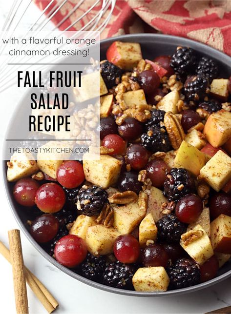 Fall fruit salad recipe by The Toasty Kitchen. This fall fruit salad is filled with fresh apples, blackberries, grapes, and pecans. Drizzled with a homemade cinnamon orange dressing that packs tons of fall flavor! #fall #fallfruitsalad #thanksgiving #halloween #apple #blackberry #grapes #cinnamondressing #nocooksidedish #sidedish #fallpicnic #homemade #cinnamon #orange #recipe Fruit Salad Cinnamon, Fall Fruit Salad With Orange Cinnamon Dressing, Fall Brunch Fruit Salad, Fruit Salad With Blackberries, Fruit Salad Brunch Ideas, Fall Breakfast Fruit Salad, Fall Fruit Side Dishes, Autumn Fruit Salad Recipes, Witchy Thanksgiving Recipes