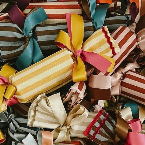 Colours of Arley on Instagram: "CRACKERS ARE BACK Our mixed boxes of striped recycled crackers have returned. Each cracker comes with a gift container inside so you can choose a small object for each member of the family. Restocked online and available for delivery or collect from the Hackney store this Saturday…Fabric is made in our workshops, crackers are made by @happy.crackers in Yorkshire." Fabric Decoration Ideas, Wedding Crackers, Liberty Christmas, Small Gift Ideas, Colorful Gift Wrapping, Christmas Cracker, Gift Wrapping Inspiration, Christmas Shoot, Holiday Gift Box