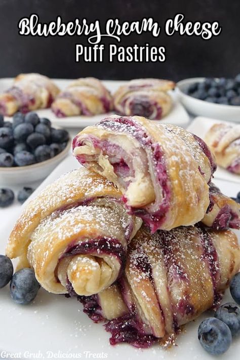 This flaky, sweet and delicious, blueberry cream cheese puff pastry dessert combines the sweet taste of fresh blueberries with a cream cheese mixture and is baked until golden and flaky, and dusted with powdered sugar. As I mentioned in a previous pastry post – in a lot of them, probably – I love making pastries....Read More Puff Pastry Dessert Designs, Cream Cheese Filled Scones, Almond Puff Pastry Danish, Blueberry Cream Cheese Pastry, Dessert With Pastry Sheets, Blueberry Crossiant, Blitz Puff Pastry Recipe, Puff Pastry Almond Paste Recipes, Cream And Berry Filled Pastry Balls