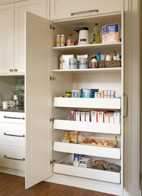 Pullout shelves help ensure items don't get lost at the back of the pantry. Located inside a tall cabinet, this kitchen pantry area features a mix of stationary and pullout shelving. #kitchenstorage #pulloutkitchenstorage #kitchenideas #kitchenstorageideas #bhg Tall Kitchen Pantry Cabinet, Modern Farmhouse Kitchen Cabinets, House Additions, Open Pantry, Cheap Kitchen Remodel, Kitchen Facelift, Pantry Drawers, Built In Pantry, Organized Pantry