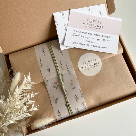 Small business packaging using Kraft paper, wildflower printed vellum, sage twine and branded sticker. Baby Footprint Kit, Etsy Packaging, Personalized Wreaths, Soya Mumu, Keepsake Baby Gifts, Baby Footprint, Packaging Ideas Business, Clothing Packaging, Small Business Packaging Ideas