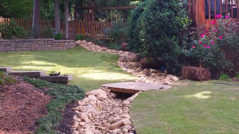 Drainage Solutions: French Drains vs. Dry Creek Beds | O'Neill Landscape Group Blog French Drain Dry Creek Bed, Bridge Over Dry Creek Bed, Dry Creek Bed For Drainage Slope, Dry Creek Bed For Drainage, French Drains, Backyard Drainage, Stream Bed, Yard Drainage, Dry Creek Bed