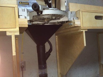 This genius miter saw dust collection method mounts the dust hood underneath and is hooked up to the dust collector. Miter Saw Dust Collection, Mitre Saw Dust Collection, Miter Saw Station, Saw Station, Shop Dust Collection, Mitre Saw Station, Saw Dust, Table Saw Stand, Woodworking Jigsaw