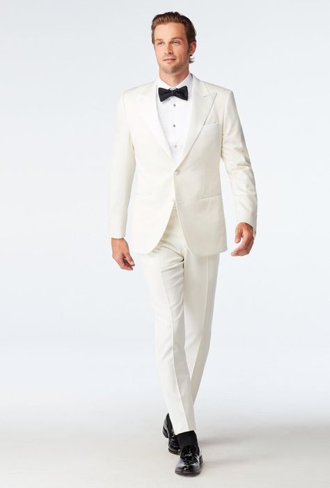 Our Hampton Ivory Tuxedo is luxurious and elegant. Made from the finest Super 140s wool blended with silk and cashmere, this exquisitely tailored suit feels every bit as good as it looks. Satin covered buttons and matching satin lapels elevate the Hampton Ivory Tuxedo even further. Ivory Tuxedo, Tuxedos Wedding, Black Tie Tuxedo, White Wedding Suit, Ivory Suit, Wedding Black Tie, Custom Tuxedo, Cream Suit, Wedding Tux