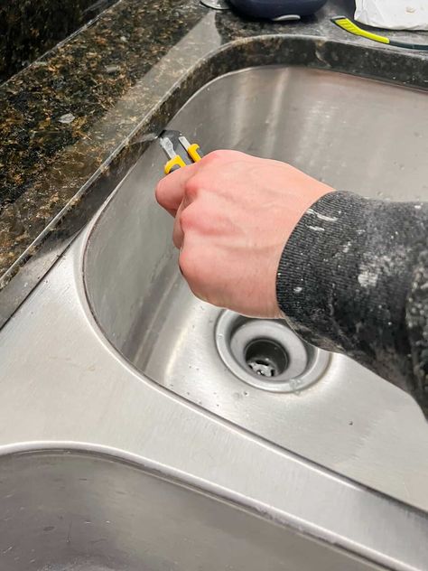 Wanting to upgrade your boring kitchen sink? Here's how to replace an undermount sink without damaging your counters. Under Mount Kitchen Sink, Replacing Kitchen Sink, Repair Cracked Concrete, Kitchen Sink Diy, White Marble Sink, Farmhouse Reno, Cracked Concrete, Sink Replacement, Sink Repair