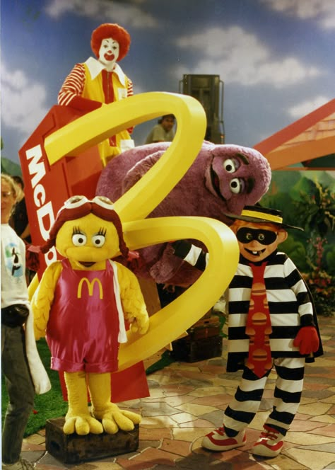 Ronald McDonald, Birdie the Early Bird, Grimace and Hamburglar in the 1993 International McDonaldland commercial called "GROWING M".  The characters plant a small golden arch in the ground, and grow an entire McDonald's Restaurant. Mcdonald Costume, Ronald Mcdonald Costume, Mcdonalds Restaurant, Mcdonald's Aesthetic, Mcdonalds Birthday Party, Golden Arch, Mcdonalds Gift Card, Mcdonald's Restaurant, Mc Donald