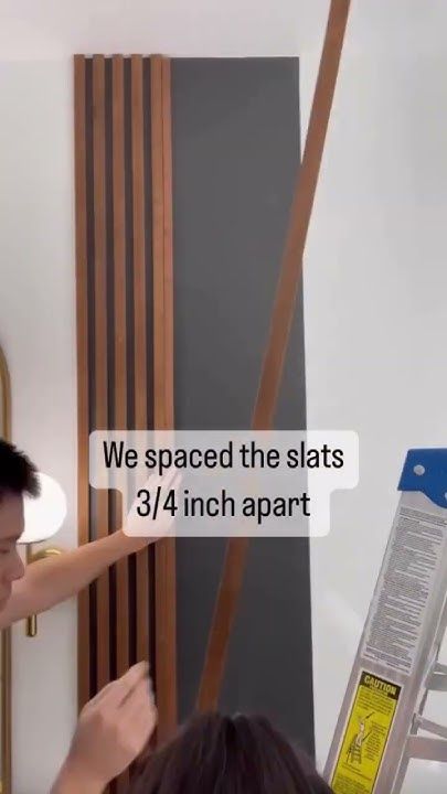 DIY Affordable Wood Slat Accent Wall || Cost Breakdown: Sanded Plywood - $25, Stain - $7 - YouTube Room Divider Slat Wall, Diy Vertical Wood Slat Wall, How To Make Slat Wall, Wood Slat Front Porch, Wood Dowel Accent Wall, Mid Century Slat Wall Bedroom, Diy Wood Slats Wall, Cheap Wood Slat Wall, Wood Slat Accent Wall Diy