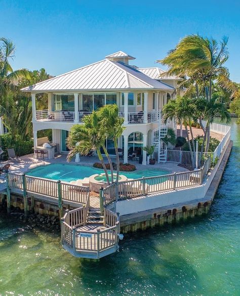 Beautiful Key West style home on the Intracoastal Waterway // Listed by: Andrew & Milla Russo | Russo Group | Illustrated Properties // #luxuryhomemagazine #luxuryhomes #luxuryrealtor #luxuryrealestate #luxe #luxury #home #house #abode #style #architecture #design #inspiration #homeinspiration #lifestyle #decor #magazine #realestate #luxurylife #realtor #homedesign #florida Key West Beach House, Key West Style Homes, Key West Style, Beach House Plans, Unusual Buildings, Intracoastal Waterway, Celebrity Houses, House And Home Magazine, Luxury Property