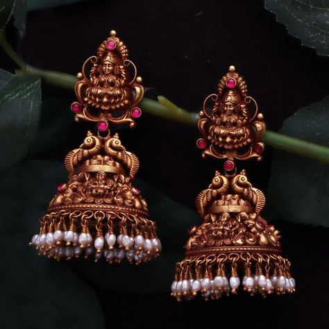 Enhance your grace and beauty with our exclusive antique collection from Pothys Swarna. From timeless neckpiece to statement jhumkas we have it all at our Chennai and Nellai showrooms, come visit us soon! #PothysSwarnaMahal #antiquecollection #bridaljewellery #bridesofindia #antiquejewellery #weddingjewellery #goldjewellery #goldweddingjewellery #bridal #goldjewelry Antique Lakshmi Earrings, Temple Jhumkas Earrings, Gold Antique Jhumkas, Bridal Jumka Design, Jhumka Designs Antiques, Antique Jhumkas Gold Temple Jewellery, Antique Jumka Design Gold, Gold Jumkas Antiques, Antique Earrings Jhumka