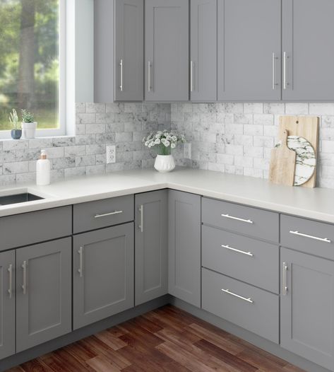 RELIABILT ready to assemble shaker style cabinets are a simple yet stylish addition to any space. The Overlake collection has a smooth painted exterior in matte gray and features all plywood, full overlay, framed construction. Its clear coat is scratch and moisture resistant, reducing damage and extending the life of your RTA kitchen cabinetry. RELIABILT Overlake 9-in W x 34.5-in H x 24-in D Gray Door Base Ready To Assemble Plywood Cabinet (Recessed Panel Shaker Door Style) | LS-SG-B09R Soft Gray Kitchen Cabinets, Backsplash Kitchen Ideas For Grey Cabinets, Cabinet Colors For Dark Countertops, Light Grey Kitchen Cabinets Farmhouse, Dark Gray Cabinets Kitchen, Backsplash For Gray Cabinets, Cream Kitchen Cabinets With Quartz, Gray Cabinet Kitchen, Flat Cabinets Kitchen