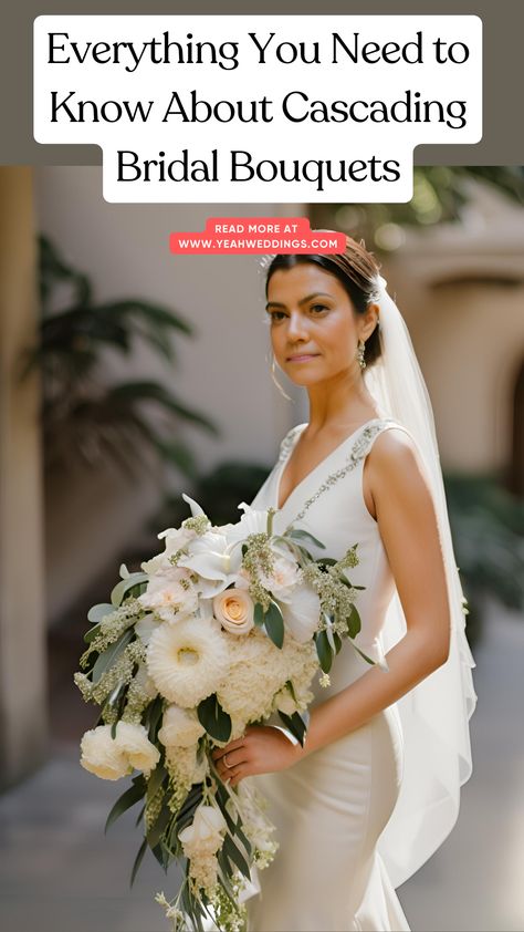 A stunning bride holding a cascading bridal bouquet, featuring elegant flowers that flow beautifully, perfect for matching her dress and wedding theme. Spring Cascading Wedding Bouquets, Bridal Arrangement Bride Bouquets, Diy Cascading Wedding Bouquet, How To Cascade Bouquet, Red Cascade Bridal Bouquet, Cascading Bride Bouquets, Blue And White Cascading Bridal Bouquet, Wedding Bouquets Shapes, Bridal Bouquet Diy How To Make