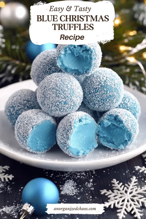 Blue Christmas Truffles start with a smooth white chocolate ganache, beautifully tinted by blue curacao, which adds a touch of warmth as they melt in your mouth. These truffles deliver a luscious blend of creamy white chocolate with a subtle citrusy note. White Chocolate Chips: 2 cupsHeavy Cream: 2 tablespoonsBlue Curacao: 2 tablespoonsSanding Sugar: 1/2 White Christmas Truffles, Easy Yummy Christmas Desserts, Blue Themed Desserts, Blue And White Food Ideas, Frostbite Blue Christmas Cocoa, White Chocolate Truffle Cake, Blue Christmas Truffles, Homemade Treats For Christmas, Christmas Truffle Recipes