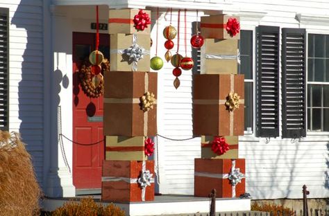 These outdoor Christmas decoration ideas are equal-opportunity offenders. Whether you like your decor showy or tasteful, you'll hate (or love) them.: Porch Columns Decorated With Christmas Gift Boxes Christmas Column Decor, Christmas Columns Outdoor, Column Decoration, Outdoor Columns, Christmas Displays, Porch Columns, Trees Christmas, Lawn Ornaments, Christmas Decorations Diy Outdoor