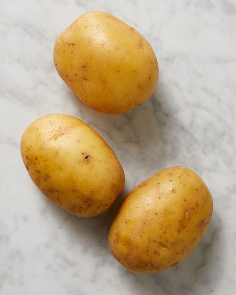 3 small potatoes on surface Cooking Substitutes, Small Potatoes, Cooking Substitutions, Types Of Potatoes, Yukon Gold, Small Potato, Primal Kitchen, White Potatoes, Outdoor Food