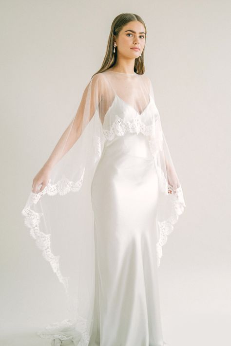 Winter Wedding Dress With Cape, Short Wedding Dress Color, Bridal Cape With Strapless Dress, Slik Wedding Dresses, Sheer Cape Wedding Dress, Wedding Dress With Waist Cape, Veil Cape Wedding Dress, Lace Cape Wedding Dress, Bridal Cape Short