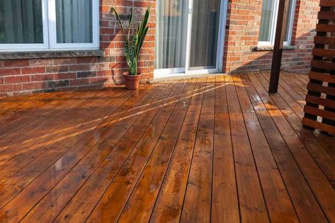 11 Deck Stain Colors That Will Make Your Deck Pop! 12 Outdoor Wood Stain Colors Decks, Stain Colors For Wood Deck, Deck And Fence Stain Ideas, Patio Deck Stain Ideas, Deck Stain Red Brick House, Green Deck Stain, Wood Porch Stain Ideas, Porch Floor Stain Colors, Stains For Decks Wood