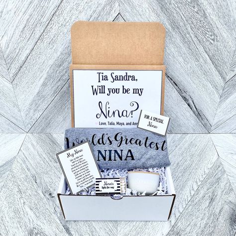 What a perfect way to ask your Nina or just as a gift! *CUSTOMIZABLE* all wordings can be changed. I have a variety of these in my shop (Any godmother box can be changed to Nina). Check them out. I also have godfather/Nino boxes too! READY TO SHIP IN 1-2 DAYSPRIORITY MAIL WITH TRACKING 1-2days WHATS INCLUDED *Everything pictured* 1. Large White box with crinkle paper with customizable Nina message and personalized signature (box is 9 in long by 6 inches wide by 4 inches high) 2. Little note (bla Will You Be My Nino And Nina Ideas, Nino And Nina Proposal Ideas, Nina Proposal Ideas, Will You Be My Nina Ideas, Cute Way To Ask Someone To Be Godparents, Nina Name, Virgin Soul Nina And Charioce, Asking People To Be Godparents, Proposal Quotes