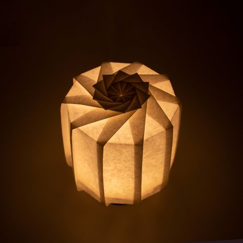 Frameless Japanese table lamp crafted with traditional Kyo-hyogu and origami techniques, featuring a unique illuminated origami pattern. Paper Lampshade Diy, Japan Lamp, Lamp Origami, Origami Light, Laser Cut Lamp, Origami Lantern, Origami Folds, Japanese Lighting, Origami Table