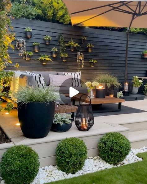 Gemma Mahabeer-Goldsmith on Instagram: "Indoor | Outdoor 🏠🌿  Creating a garden as an extension to the downstairs living areas was high up on our priority list pre reno. A view to look out on & somewhere to enjoy as a family - to entertain, cook & bask in how ever much sunshine the great British weather cares to lavish on us.   Cut to four years later & last summer was the first time I really felt it starting to come together. Gardens are a labour of love. They evolve over time. We are far from finished but god, am I excited to get out there again soon 🌿.  Gem x  Kitchen @handmadekitchenschristchurch  Doors @fabcosanctuaryltd  Composite deck @millboardflooring  Sandstone patio @stonemarket_uk  Corner seating @beliani_uk (previous PR) Shade @ikeauk  Planters @getpotted_com (previous PR) F Finished Backyard Ideas, Back Garden Patio Ideas Uk, Corner Decking Ideas Garden, Decking Ideas Garden Uk, Corner Decking Ideas, Garden Seating Area Ideas, Corner Decking, Uk Garden Ideas, Corner Patio Ideas