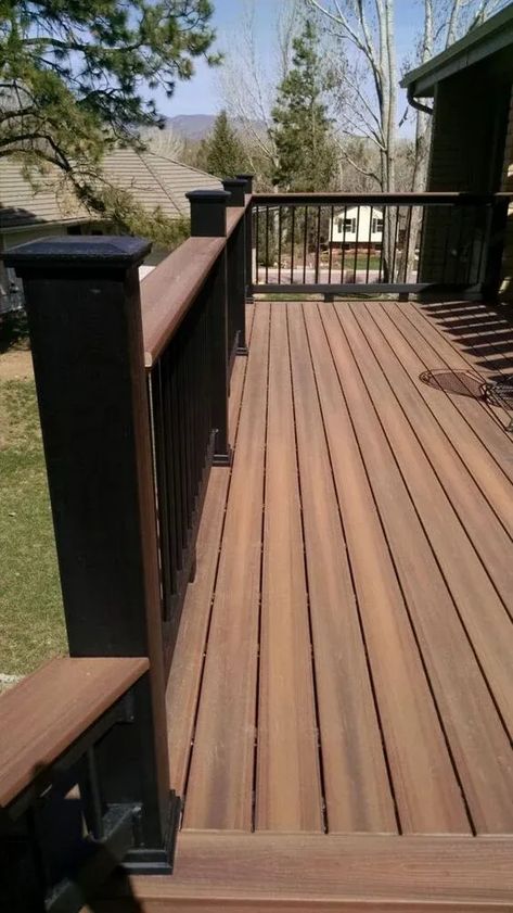 Discover the benefits and considerations of composite decking for your home. This comprehensive guide provides homeowners with valuable information on safety, eco-friendliness, and maintenance. Budget Deck Ideas, Composite Deck With Wood Railing, Deck Patio Furniture Ideas, Timber Tech Deck Colors, Dark Wood Deck, Black Decking Ideas, Decking Colours Ideas, Timbertech Deck Ideas, Trex Deck Ideas