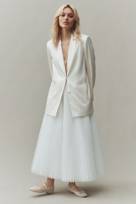 The Reformation Vera Satin Blazer exudes a bridal vibe with its elegant satin fabric and tailored silhouette, perfect for a modern bride. | Vera Satin Blazer Jacket by Reformation in White, Size: XL, Polyester/Acetate at Anthropologie Bridal Blazer And Skirt, Blazer With Wedding Dress, Bride In Pants, Courthouse Bridal Look, Nonbinary Wedding Attire, Wedding Blazer Women, Vogue Wedding Photography, White Dress With Jacket, Satin Dress With Jacket