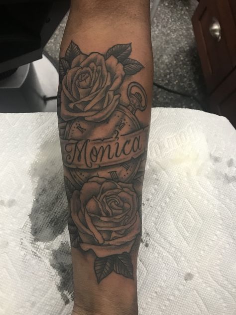 Rose Clock Ribbon Name tattoo for MOM Tattoo With Roses And Name, Name Half Sleeve Tattoo, Forearm Tattoo With Roses, Mom Name Tattoo Ideas Men, Tattoo Ideas Mom Name, Name Tattoo With Roses Forearm, Forearm Tattoo Moms Name, Mom Rose Tattoo For Men, Forearm Mom Tattoo