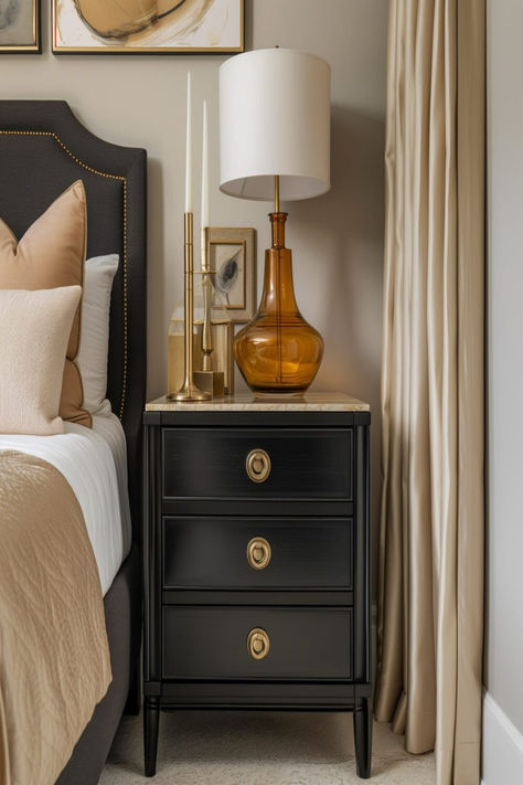 Sophisticated bedroom showing a black nightstand with golden lamp and decor, complementing the neutral-toned bedding. Nightstands With Black Iron Bed, Traditional Bedroom Inspirations, Bedroom With Different Nightstands, Black Bed Nightstand Ideas, Black Nightstand Styling, Black Lacquer Furniture, Vintage Black Furniture, How To Style Black Bedroom Furniture, Bedroom Black Furniture Decor