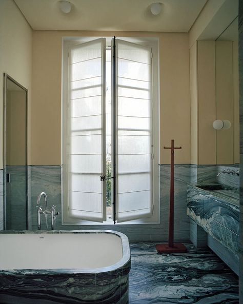 Lias stone defines the bath. Dornbracht tub filler. C. 1925 Jean-Michel Frank coatrack. Gray Streaks, Pierre Yovanovitch, Daybed Design, Paris Home, Oak Shelves, Oak Panels, Marble Flooring, Bathroom Color, Parisian Apartment