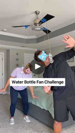 13M views · 68K reactions | Blindfolded Water Bottle Fan Challenge | He got rocked by the bottles! 🤣 | By Team Balmert | Is it still on? This is called the Water Bottle Fan Challenge. Basically, you just put a blindfold on, you tie a water bottle to a fan, and you get hit in the face. You try not to get hit in the face. I didn't mean to do that. Boy, we should have dusted before we did this. You're going to pull that blade off. Yeah, probably. I hang this fan. I trust my craftsmanship. I don't. Not me either. Is that long enough? What speed do we start off at? Um. We're doing high. High. Oh. Okay. Oh. Okay. Oh god. That might be too fast. Shut it down. Oh god. Look at the pants. That's not going to work. Okay, stop talking. Probably best if we just ease into this. We'll start with low. Th Water Bottle Fan Challenge, Water Bottle Challenge, Stop Talking, Family Activities, Going To Work, Couple Goals, Youtubers, Funny Gif, Water Bottle