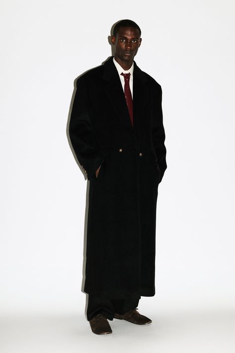 Traditional Wall Street menswear meets west coast casual. Blending precise tailoring with an effortless, oversized silhouette, this supremely relaxed statement coat features broad, padded shoulders, a double breasted front closure and notch lapels. Named after Manhattan Beach in the South Bay, this versatile overcoat works with Tabis, sandals and socks or sneakers for an elevated, everyday luxury.