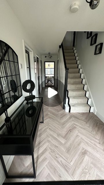 Nicola - The Monochrome Manor on Instagram: "H A L L W A Y   My favourite transformation, our hallway!   Carpet & flooring - Carpet Connection (Ordered/fitted) Carpet - Primo Grande in almond mousse by  STS Flooring  LVT Flooring - Inspiration in English Oak Grey Beige, Tarkett Glass door - Leader Doors Ceiling light - B&Q Prints - The House Outfit Black paint (doors & banister) - Loof, Frenchic  #bellway #bellwayhomes #bellwaynewbuild #bellwayhomesnewbuild #bellwayhome #newhouse #newhome #newbuildhome #housebuilding #house #homeaccounts #homeaccountuk #homeaccount  #diyinteriordecorating #diyhomedecor #homesofinsta #newbuildjourney #realhomesofinstagram #housetohome #neutraldecor #monochromedecor #monochromehome #monochromehomes #herringbonefloor #carpetrunner #hallway #hallwayinspo #mono Landing Flooring Upstairs, Monochrome Stairs And Landing, Black And Grey Hallway Ideas, Hallway Floor Ideas, Monochrome Hallway Ideas, Beige And Black Hallway, Black And Beige Hallway, Grey Carpet Stairs, Hallway Flooring Ideas