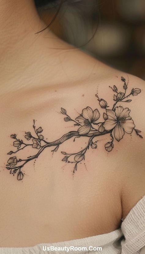 A black ink collarbone tattoo of a floral branch, featuring detailed line work and delicate flowers, creating a graceful and natural design. Small Collarbone Tattoo, Best Spine Tattoos, Collarbone Tattoo Ideas, Collarbone Tattoos, Symmetrical Tattoo, Small Neck Tattoos, Spine Tattoo Ideas, Tattoos For Men And Women, Collarbone Tattoo