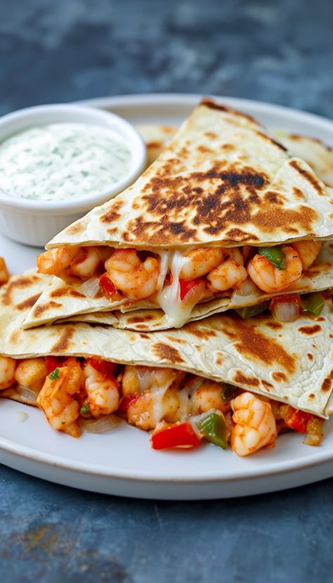 If you're looking for a vibrant and delicious meal that combines succulent prawns with melty cheese and fresh ingredients, you're in for a treat with this prawn quesadilla recipe. This dish is not only quick to prepare but also makes for a satisfying meal whether it's a casual lunch or a festive gathering. Let's explore how to make this delightful dish that will tantalize your taste buds.
Ingredients You'll Need For Prawn Quesadilla
Before you get started, gather all the ingredients. Here’s wh Shrimp Quesadillas Recipes, Prawn Quesadilla, Spicy Shrimp Quesadilla, Shrimp Quesadilla Recipe, Prawn Koliwada, Hatch Green Chili Recipe, Green Chili Recipes, Melty Cheese, Prawn Recipes