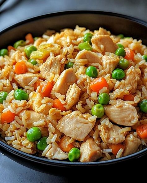 Chicken Fried Rice Recipe 🍚 Ingredients - 2 cups cooked rice (preferably day-old) - 1 cup cooked chicken, shredded or diced - 2 tablespoons vegetable oil - 2 eggs, lightly beaten - 1 cup mixed vegetables (peas, carrots, corn) - 3 green onions, chopped - 3 tablespoons soy sauce - 1 tablespoon oyster sauce (optional) - 1 teaspoon sesame oil - Salt and pepper to taste Instructions 1. Heat 1 tablespoon of vegetable oil in a large skillet or wok over medium-high heat. 2. Add the beaten eggs a... Chicken Shredded, Chicken Fried Rice Recipe, Soul Food Dinner, Cooked Rice, Cooked Chicken, Food Babe, Chicken Fried Rice, Chicken Fried, Fried Rice Recipe