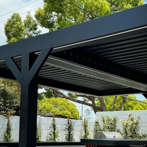 Myriad Construction Co. Inc. on Instagram: "Show stopper alert ‼️ We pulled off the double cantilever louvered patio cover. This gorgeous all black signature series louvered system from outdoor elements USA has warm white led down lighting and RGB up lighting.  It’s complimenting the incredible design by @mikepyledesign and the exquisite landscape/hardscape by @morselandscapes. Tell us what you think?  #backyardinspo #backyardoasis #patioideas #costamesa #luxurybackyard #modernpergola #modernpatio #louveredroof #patiocovers #outdoorkitchen #outdoorentertaining" Louvered Patio, Landscape Hardscape, Up Lighting, Down Lighting, Modern Pergola, Patio Cover, Led Down Lights, Backyard Inspo, Modern Patio