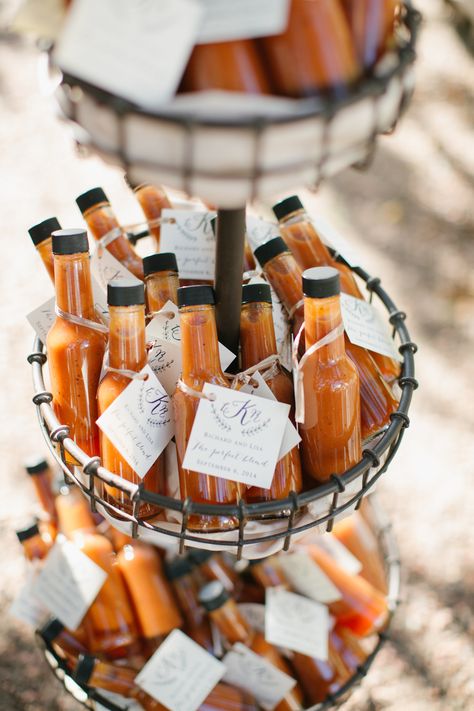 For a homespun twist on hot sauce wedding favors, we love how this bottle put the rich orange color of the sauce on display. A monogrammed label was the perfect finishing touch. Hot Sauce Wedding, Hot Sauce Wedding Favors, Food Wedding Favors, Tuscan Inspired Wedding, Summer Wedding Reception, Creative Wedding Favors, Wedding Favors And Gifts, Edible Favors, Favors Ideas