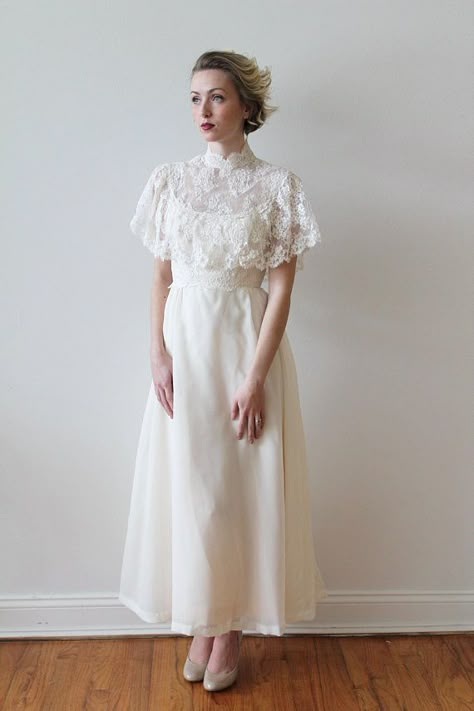 Vintage 1970s High Neck Ankle Length Wedding Dress with French #weddingdress 1970’s Wedding Dress, Wedding Dress Capelet, High Neck Lace Wedding Dress, Hanbok Wedding Dress, Ankle Length Wedding Dress, French Lace Dress, 1970s Wedding Dress, Lace Capelet, Blush Skirt