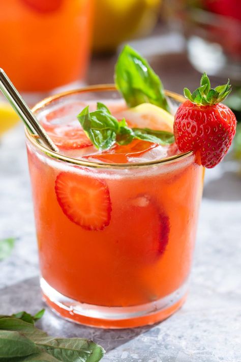 This Strawberry Basil Lemonade is a fun summer twist on the classic lemonade. It's made with fresh strawberries, basil, and just a touch of agave syrup. It's easy to make, low in sugar, and so refreshing! Perfect for serving at backyard barbecues or simply enjoying on its own. Peach Green Tea Lemonade, Classic Lemonade, Strawberry Basil Lemonade, Passion Tea Lemonade, Matcha Lemonade, Green Tea Lemonade, Pitcher Cocktails, Peach Green Tea, Basil Lemonade