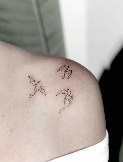 Simple And Elegant Tattoos, Small Tattoos Black And White, Dragon Tattoo White Ink, White Ink Dragon Tattoo, Small Dainty Dragon Tattoo, Minimal Tattoo Dragon, Small Black Dragon Tattoo, Small Dragon Tattoo For Women Simple, Long Live Tattoo Taylor Swift Dragon