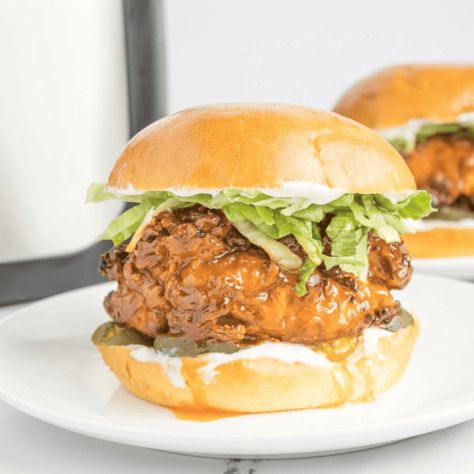 Air Fryer Hot Honey Chicken Sandwich - Fork To Spoon Air Fryer Hot Chicken, Hot Honey Chicken Sandwich, Honey Chicken Sandwich, Chicken Tortillas, Hot Honey Chicken, Kfc Chicken Recipe, Hot Chicken Sandwiches, Marinated Chicken Thighs, Spicy Chicken Sandwiches