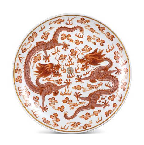 A LARGE IRON-RED DECORATED 'QIANQINGGONG' 'DRAGON' DISH MARK AND PERIOD OF GUANGXU deftly painted in tones of iron red with two dragons vying among clouds for a 'flaming pearl', the underside similarly painted with two dragons confronting each side of a stele inscribed with the three characters Qianqinggong, the base inscribed in iron red with a six-character reign mark Dragon Plate, Chinese Arts And Crafts, Three Characters, Dragon Designs, Catalog Request, Dragon Shop, Chinese Mythology, Iron Red, 5 Elements