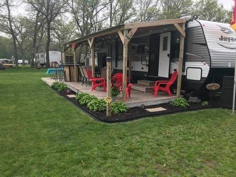 Outside Of Camper Ideas, Landscape Ideas Around Camper, Deck On Camper, Camp Porch Ideas, Camper Permanent Site, Camper Lot Landscaping, Diy Rv Patio Ideas, Seasonal Camping Sites Landscaping, Rv Porch Ideas