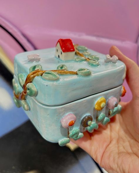 Certainly! Here’s an updated version: Take a journey to a dreamy world with my handmade ceramic jewelry box, complete with a tiny house and clouds! 🌸✨ This special box is a sweet little home for your treasures☺️ Jewelry Box Ceramic, Slab Box Ceramics Ideas, Ceramic Box Ideas, Ceramic Boxes With Lid, High School Ceramics, Ceramic Jewelry Box, Clay Box, Handmade Ceramic Jewelry, Slab Ceramics